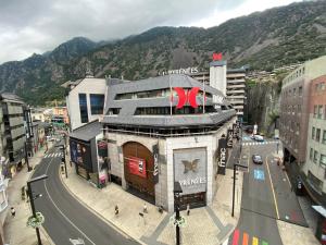 a large building on a city street at Somriu Hotel City M28 in Andorra la Vella