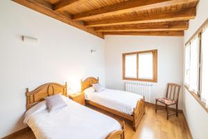 A bed or beds in a room at Casa rural Gibelea y Gibelea Txiki