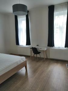 Postel nebo postele na pokoji v ubytování Znojmo apartmány