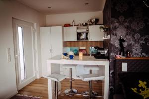 Kuchyň nebo kuchyňský kout v ubytování Das Appartement