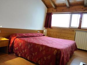 Cama o camas de una habitación en Hotel La Rosa