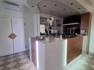 Kuchyň nebo kuchyňský kout v ubytování Hotel Rivabella