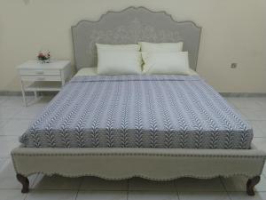 Säng eller sängar i ett rum på Residence villa 106