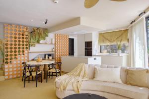 a living room with a couch and a table at 11 Holiday Homes in San Miguel de Abona