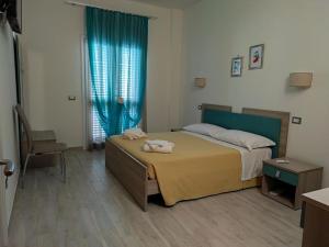Postel nebo postele na pokoji v ubytování Il Negramaro