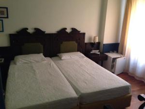 Voodi või voodid majutusasutuse Hotel Aliki toas