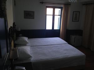 Voodi või voodid majutusasutuse Hotel Aliki toas