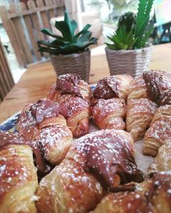 a pile of pastries sitting on top of a table at Il terrazzo dei nonni in Modica