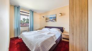 Postel nebo postele na pokoji v ubytování Continental, Sun & Snow