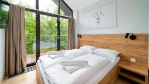 Posteľ alebo postele v izbe v ubytovaní Apartamenty Sun & Snow Resort Karkonosze