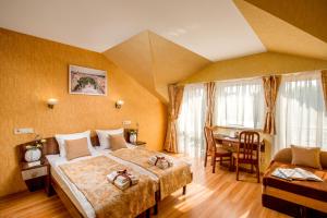 Postel nebo postele na pokoji v ubytování Hotel&SPA Pysanka, Готель Писанка, 3 сауни та джакузі - індивідуальний відпочинок у СПА