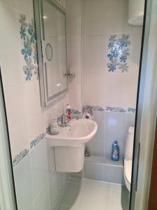a small bathroom with a sink and a shower at ЗАРА in Ruse +19 photos