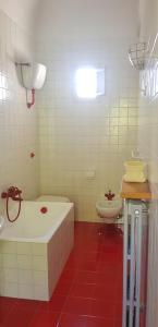 a bathroom with a bath tub and a toilet at Villa Staffieri in Cappelle sul Tavo