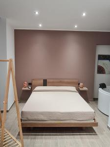 Ліжко або ліжка в номері Dimore Albrunè
