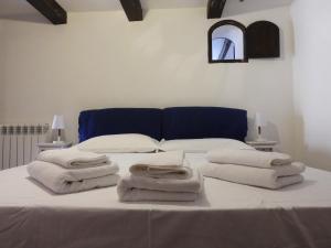 a bedroom with a bed with towels on it at Best Apartment in Rome Campo de Fiori in Rome