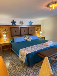 Postel nebo postele na pokoji v ubytování B&B Torre Pozzillo