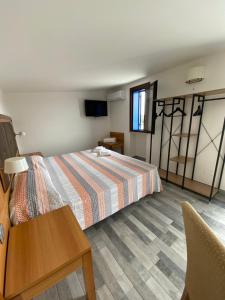 Postel nebo postele na pokoji v ubytování B&B Torre Pozzillo
