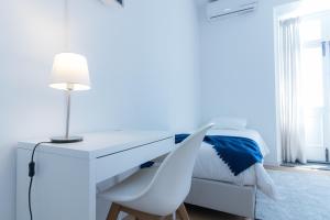 Postel nebo postele na pokoji v ubytování Lagoa Hostel & Suites