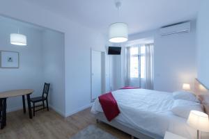 Postel nebo postele na pokoji v ubytování Lagoa Hostel & Suites
