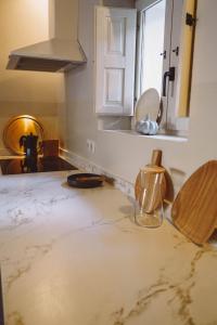 a kitchen with a damaged counter top at Ronda City Wall Apartments with Private Pool in Ronda