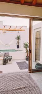 a room with a bed and a glass door at Ronda City Wall Apartments with Private Pool in Ronda