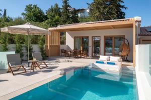 Bazén v ubytování Sivota Kipoi Design Suites nebo v jeho okolí