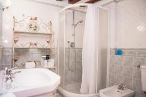 a bathroom with a shower and a sink and a toilet at Appartamenti Superior in Via Garibaldi by Bricola Apartments in Venice