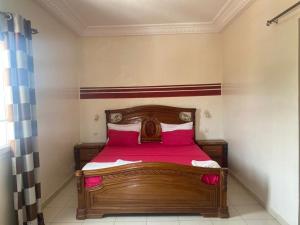 Giường trong phòng chung tại Résidence Kalado Saly