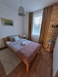 Posteľ alebo postele v izbe v ubytovaní Art Gallery Apartment
