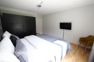Postel nebo postele na pokoji v ubytování Armotti Apartments Friedheim