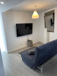 A television and/or entertainment centre at PG HOUSE & SUITE