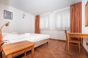 Posteľ alebo postele v izbe v ubytovaní Appartamento Smith Ruché - Affitti Brevi Italia
