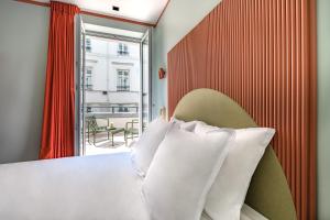 Postel nebo postele na pokoji v ubytování O.Lysée Hotel
