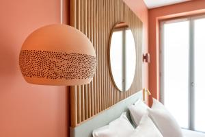 Postel nebo postele na pokoji v ubytování O.Lysée Hotel