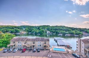 an aerial view of a marina with boats in the water at Osage Beach Condo with Shared Pool and Lake Views! in Osage Beach