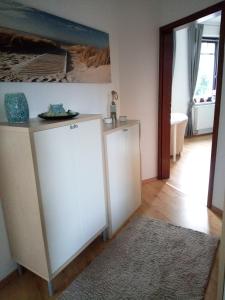 a room with two white cabinets and a bathroom at SUNNY SIDE in Kiel