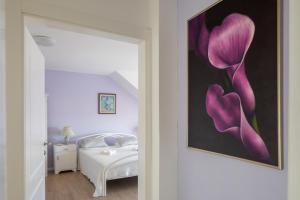 Postel nebo postele na pokoji v ubytování Villa Pomalo