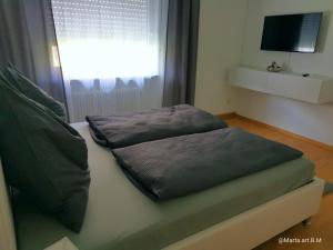 two pillows sitting on a bed in a room at Milonia 3 in Bernkastel-Kues