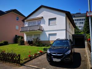 a car parked in front of a house at Milonia 3 in Bernkastel-Kues