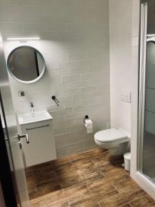 a bathroom with a toilet and a sink at Bohem Prague Hotel in Prague