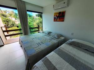 Ένα ή περισσότερα κρεβάτια σε δωμάτιο στο Apartamento Kosomao