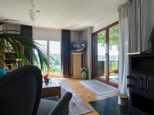 a living room with a couch and a fireplace at Ferienhaus Birdy in Blieskastel