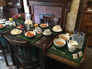 a table with plates of food on top at The Denes in Lynton