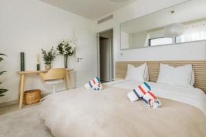 a bedroom with two beds with pillows on them at Monaco view, pool, garage, 100 m2 terrace in Beausoleil +64 photos