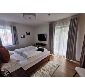 A bed or beds in a room at Appartamento Giovanna Rosegg