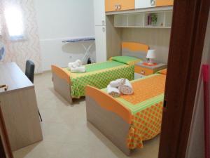 A bed or beds in a room at Casa Violetta