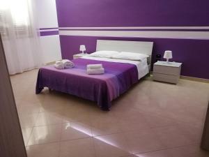 A bed or beds in a room at Casa Violetta