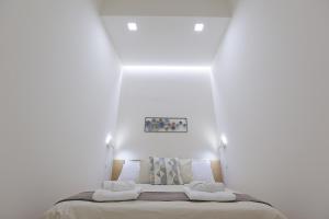 En eller flere senge i et værelse på Casa Ancora