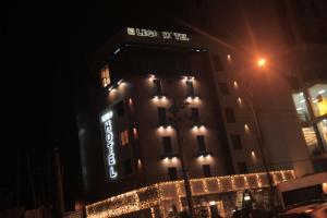 a building with a sign on it at night at Lego Star Hotel in Addis Ababa