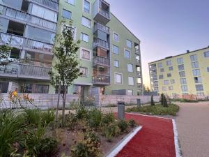 a building with a red carpet in front of it at The Seabreeze Apartment Turku in Turku